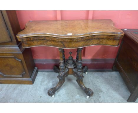 A Victorian burr walnut serpentine card table