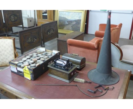 An Edison Standard Phonograph, serial no. SL 25053, in oak domed case, with metal horn speaker, winding handle and approx. 40