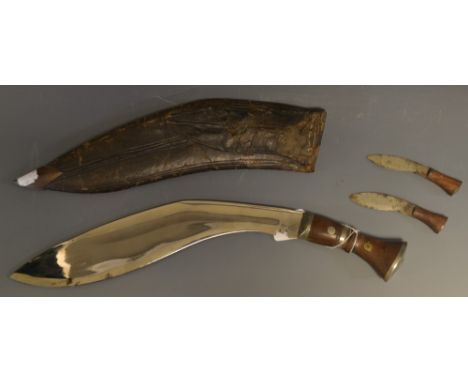 A Gurkha kukri, 32cm curved blade, two-piece wooden grip, domed pommel, leather scabbard with two typical sharpeners, 46cm lo