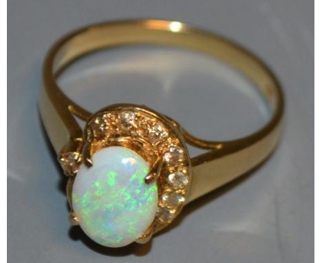 A 14ct gold, opal and diamond ring