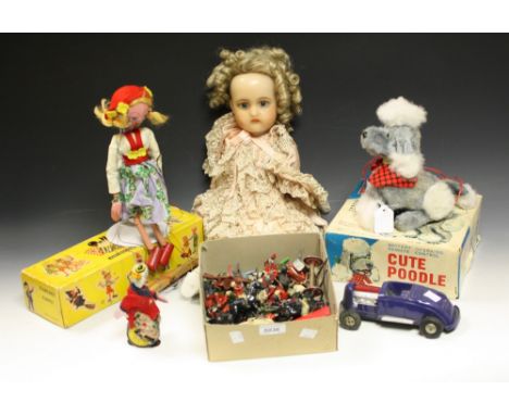 Toys and Juvenalia - a Japanese clockwork tin plate unicycling clown, felt jacket, impressed Japan; a Japanese battery operat