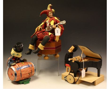 A wooden automaton, piano player; a clockwork automaton Jester, with a lute, his right arm moves; a tinplate monkey pushing w