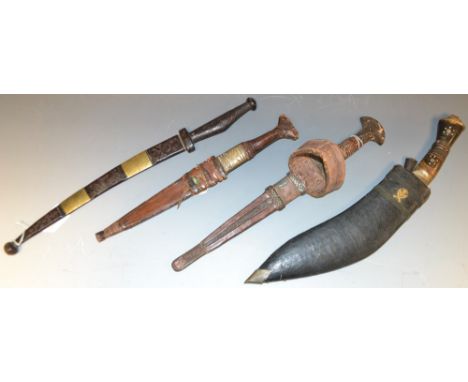 A Tuareg tedda/tubu arm dagger, 27.5cm blade, hide bound grip and scabbard, 41.5cm long overall, 19th century; other daggers,