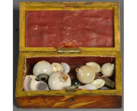 A collection of 19th century glass eyes; a Victorian tortoiseshell snuff box (2) 