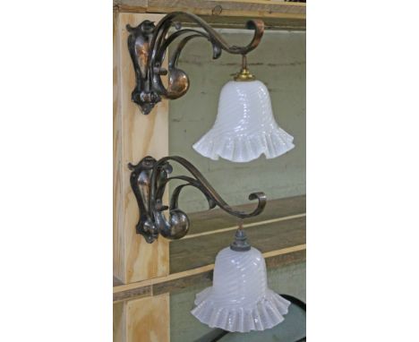 A pair of Arts &amp; Crafts wall lights in the manner of Benson with crimped and twisted milk glass shades, depth from wall 3