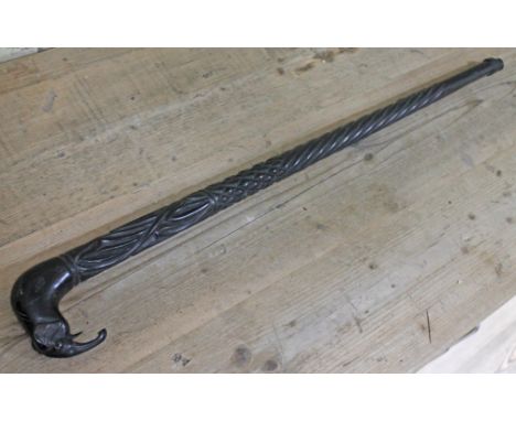 An African carved ebony walking stick with elephant handle, length 91cm. 