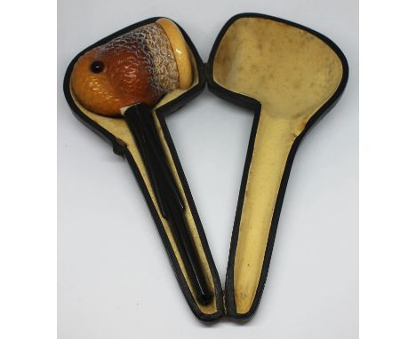 A vintage meerschaum pipe formed as a snipe with glass eyes and bakelite mouthpiece, with box.  