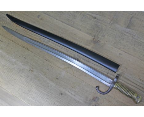 A French bayonet with scabbard, sword length 70cm.Condition: small dent to scabbard as pictured, one stamp to blade also as p