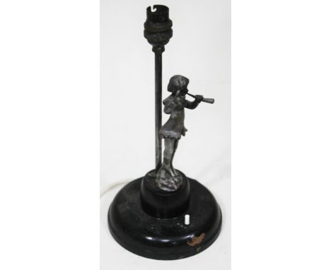 A table lamp with white metal figure depicting the pied piper, height 29cm.  