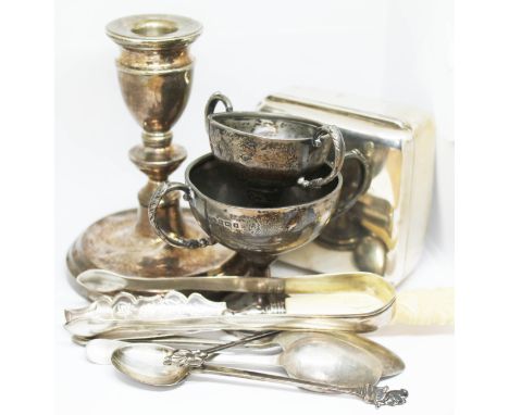 A mixed lot of mainly hallmarked silver including a cigarette box, a candlestick, two trophies, a pair of sugar tongs, four s