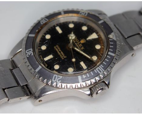 A vintage 1965 Rolex Oyster Perpetual Submariner 5513 stainless steel watch, with signed gloss black gilt 'meters first' dial