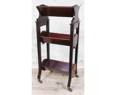 An Edwardian mahogany book trough or magazine rck, height 76cm.  