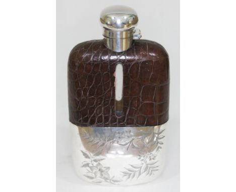 A silver plated and leather bound hip flask by Walker &amp; Hall, length 18cm.  Condition - good, glass appears damage free, 