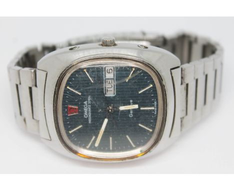 A vintage 1973 stainless steel Omega Geneve Megaquartz day date wristwatch with blue tone signed dial, hour batons and hands 