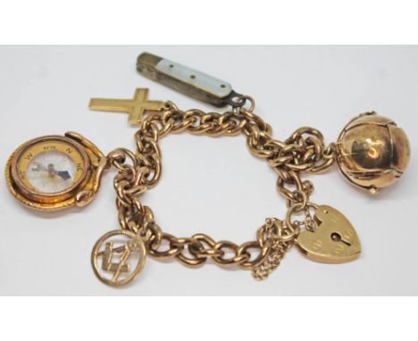 A 9ct gold charm bracelet featuring five charms comprising a Masonic crucifix ball marked 'Silver &amp; Gold', hallmarked cru