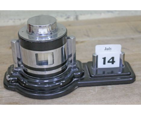 An Art Deco chrome and back finish barometer and perpetual calendar.  