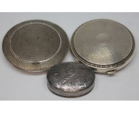 A mixed lot of silver comprising a German silver compact with gilt interior, a hallmarked silver compact and an imported silv