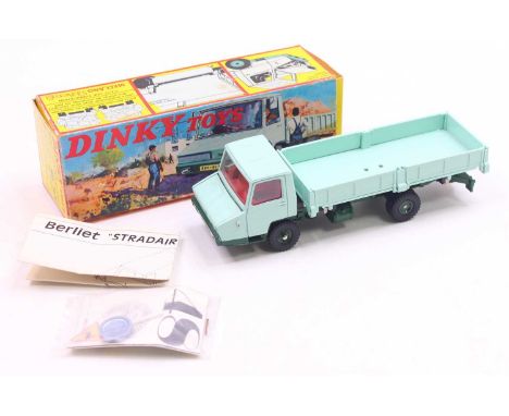 French Dinky Toys No. 569 Berliet Open Back Tipper Truck comprising a turquoise cab and back, dark green chassis and hubs, wi