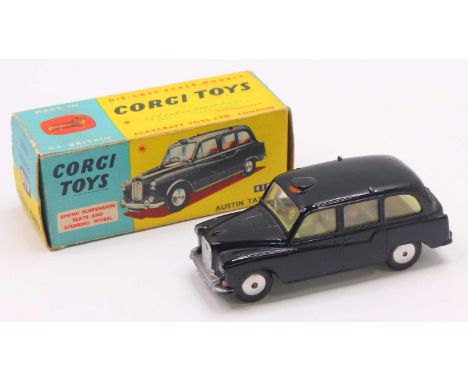 Corgi Toys No.418 Austin Taxi, comprising of black body with lemon interior and spun hubs, housed in the original blue and ye
