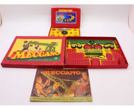 Two Meccano sets to include a Meccano Gears Outfit B, with box lid for Gears Outfit A, all strung to the original card insert