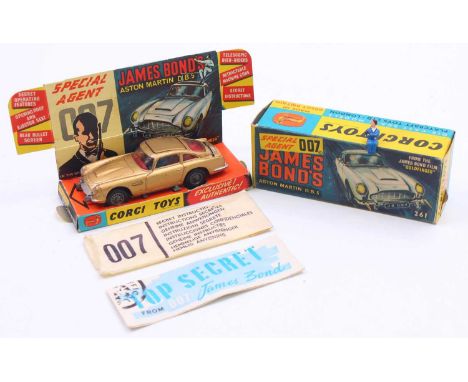 Corgi Toys No. 261 James Bond's Aston Martin DB5, metallic gold body, with wire wheels, comes with both figures, sold in the 