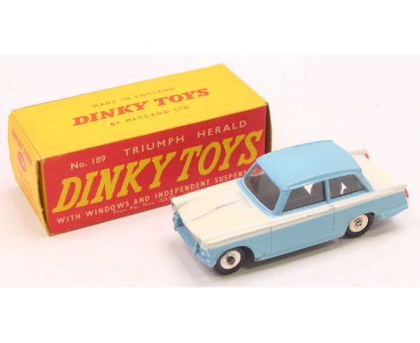 A Dinky Toys No. 189 Triumph Herald comprising blue &amp; white body with spun hubs, housed in the original card box (VG-BVG)