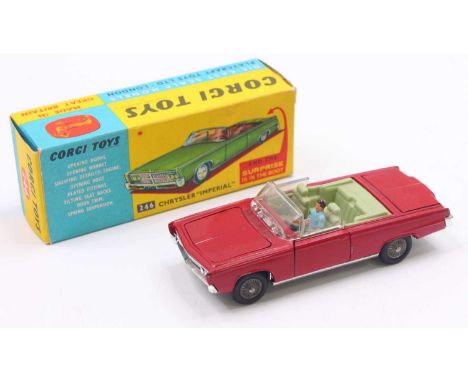 Corgi Toys No. 246 Chrysler Imperial comprising red body with green interior, cast wirework hubs, with golf trolley load and 