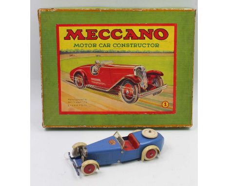 Meccano no.1 constructor car, in blue with red hubs, and red interior, housed in the original box, with some loose components