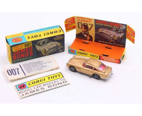 Corgi Toys No. 261 James Bond Aston Martin DB5 comprising of gold body with red interior, and cast wire work hubs, all mechan