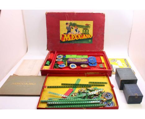 Meccano outfit no.8, comprising green and red components, all unstrung from the original card base, with boiler, unchecked fo