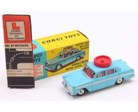 Corgi Toys No. 236 Motor School Car comprising of light blue body with red interior, and spun hubs with working steering mech