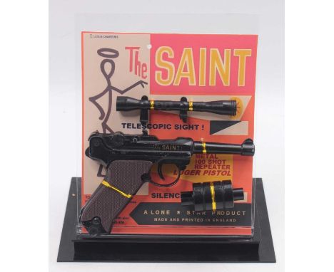 Lone Star Products, The Saint 100 Shot Repeater Luger Pistol on reproduction backing card, with Sight and Silencer attachment