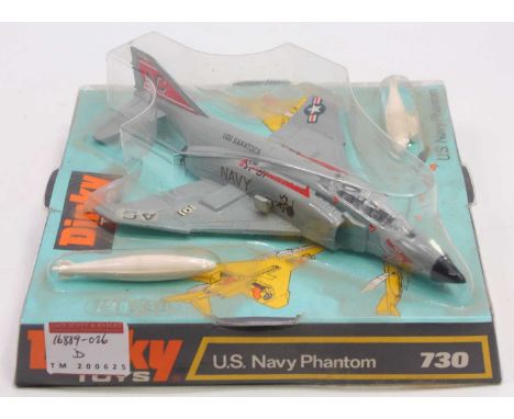 A Dinky Toys No. 730 US Navy Phantom comprising grey body with jet intake danger and mouse with bomb transfers to the side, n