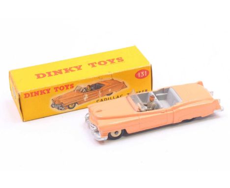 Dinky Toys No. 131 Cadillac El Dorado Tourer comprising of pink body with grey interior and grey hubs with driver figure, in 