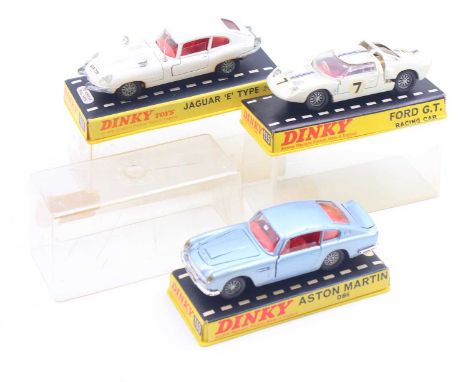 Dinky Toys group of 3 plastic cased diecasts to include; No.131 Jaguar E Type 2+2 in white (possibly retouched as visible mar