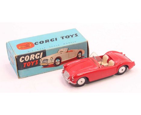 Corgi Toys 302, M.G.A sports car in red, mint condition with flat spun hubs with Corgi leaflet in a blue original card box (N