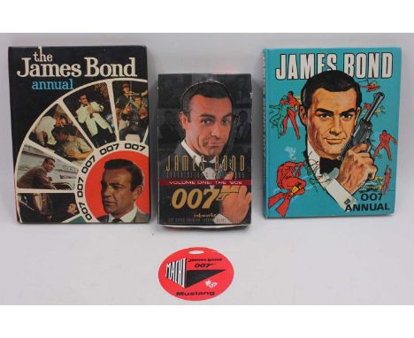 A collection of James Bond annuals and associated effects to include James Bond World Distributors Annual, an empty James Bon