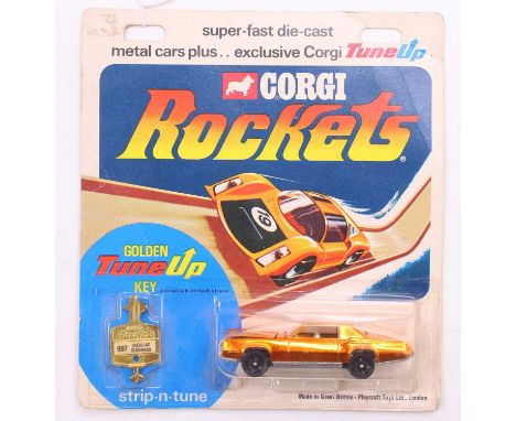 Corgi Rockets 907 Cadillac Eldorado - copper plated finish with white interior, unpainted base, on the original backing card
