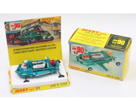 Dinky Toys No. 102 Joe's Car comprising a metallic blue body with white fold-out wings and chrome and red plastic engine fitt