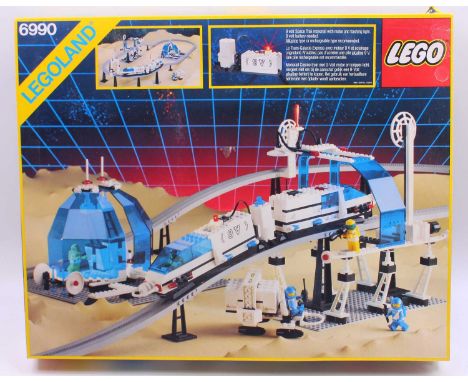 Lego Space No. 6990 Monorail Set, the box contains various components including a track, partially built train, base plates, 