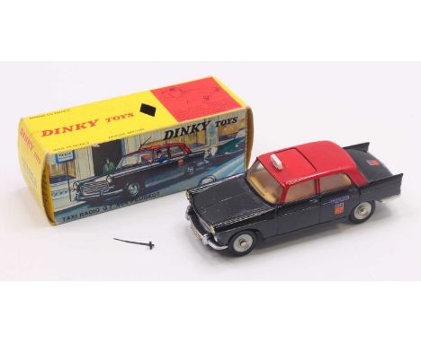 French Dinky Toys No. 1400 Peugeot 404 Taxi Radio G7, comprising a black body, with a red roof, tan interior, concave hubs, a