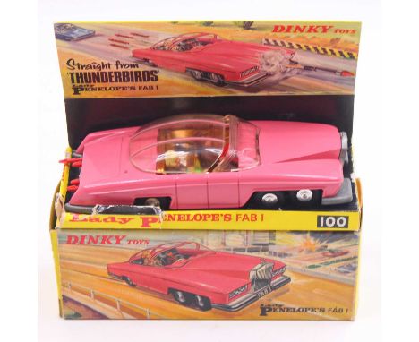 Dinky Toys No.100 Lady Penelope's Fab 1, comprising a matt pink body with gold chromed interior, with two figures, a red plas