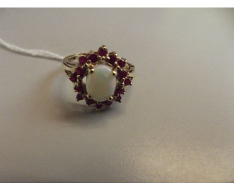 9 ct gold opal and garnet dress ring 