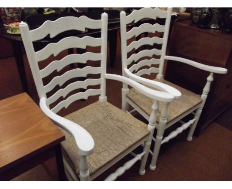 Pair of rush seated ladder back carver chairs, paimted white 