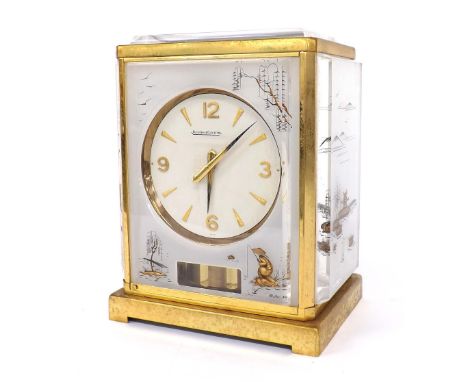 Jaeger LeCoultre Marina model Atmos clock, the 4.25" white dial within a flexi-glass and brushed brass bound case gilded with