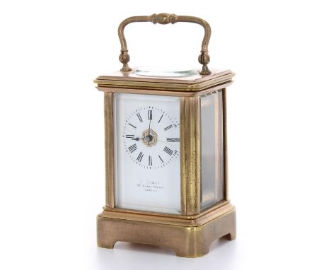 Miniature carriage clock timepiece bearing the retailer's name J. Edmond, 67 Baker Street, London on the white enamel dial, w