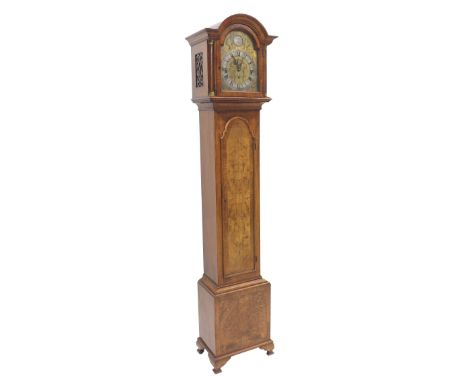 Good walnut three train grandmother clock, the movement with eight hammers striking on rods, the 8.75" brass arched foliate e