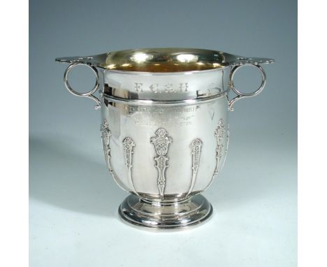 An Edwardian silver two handled pedestal trophy cup, by James Dixon & Sons, Sheffield 1905, the body with moulded girdle and 