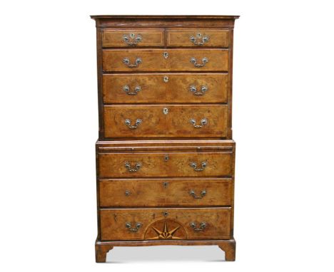 A George I walnut chest on chest, the upper part with two short and three long drawers between fluted columns, the lower part