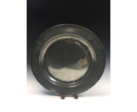 A pewter charger bearing touch marks for William Hogg, Newcastle, active 1780-1815, an incised ring within the broad rim, 41.